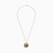 The 14K Yellow Gold Multi Sapphire and Tsavorite Floral Pendant, 7.53 TCW, features a cluster of colorful sapphire gemstone flowers arranged in a circular design for an eye-catching statement.
