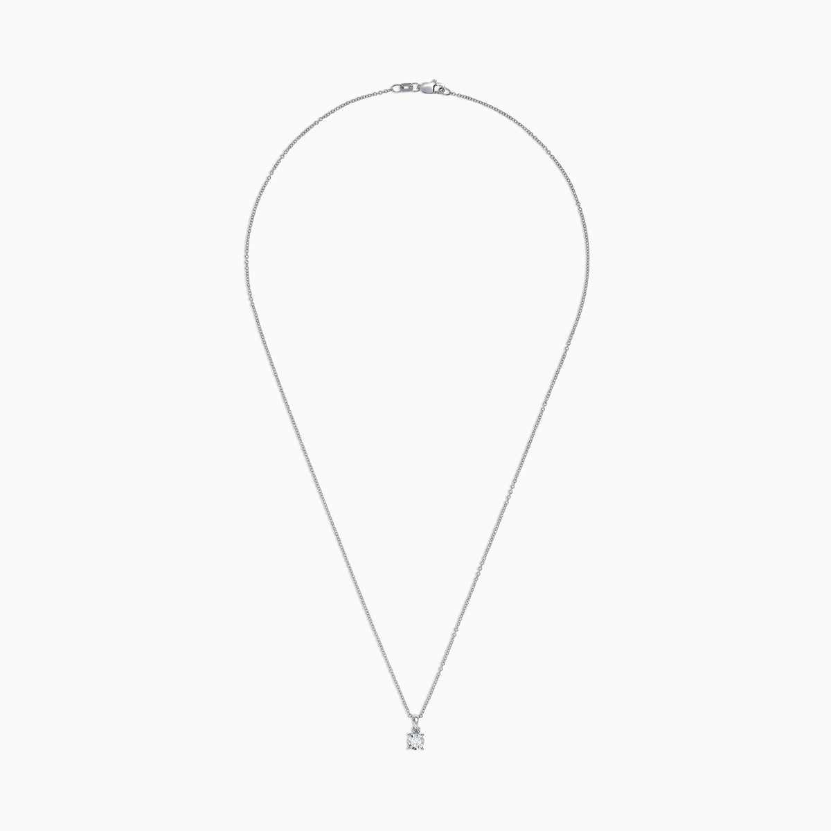 The Pave Classica 14K White Gold Diamond Solitaire Pendant features a single 0.15 TCW diamond in a simple prong setting, suspended from a delicate chain.
