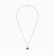 The Novelty 14K Yellow Gold Sapphire & Diamond Evil Eye Pendant (0.42 TCW) features blue sapphires and white diamonds in concentric circles, forming the classic evil eye motif on a gold chain necklace.