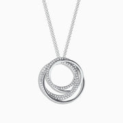 The Pave Classica 14K White Gold Diamond Pendant (0.41 TCW) features intertwined circles adorned with sparkling diamonds, elegantly suspended from a delicate chain against a white background.