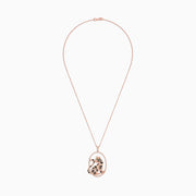 The Signature 14K Rose Gold Diamond and Emerald Panther Pendant (1.75 TCW) features an oval panther design with dazzling diamond accents, sparkling white and black stones, vibrant green gem eyes, all suspended from a delicate chain.