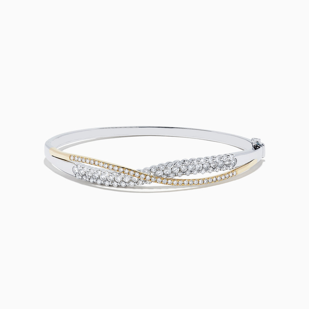 The 14K White and Yellow Gold Diamond Crossover Bangle features intertwined gold bands with sparkling diamonds totaling 2.00 TCW, and a hinged design for easy wear and a secure fit.