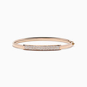 The 14K Rose Gold Diamond Pave Bangle, 1.00 TCW, features a rectangular diamond-encrusted section and is elegantly displayed on a plain white background.