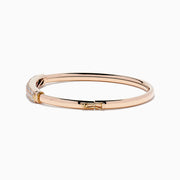 The 14K Rose Gold Diamond Pave Bangle, 1.00 TCW, features a rectangular diamond-encrusted section and is elegantly displayed on a plain white background.