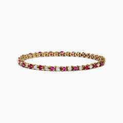 The 14K Yellow Gold Ruby and Diamond Tennis Bracelet, 3.85 TCW, showcases alternating round rubies and white diamonds set in a single elegant row.
