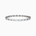 The 14K White Gold Diamond Tennis Bracelet features a row of emerald-cut diamonds set in a sleek 14K white gold band, displayed on a plain white background.