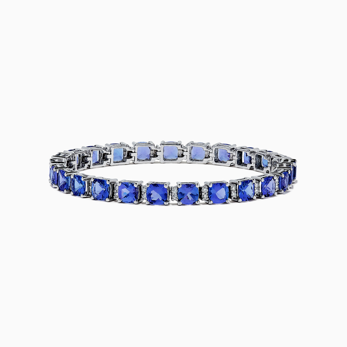 The Nahla Siri 14K White Gold Tanzanite & Diamond Tennis Bracelet, 14.74 TCW, showcases prong-set square-cut tanzanites and diamonds in a sleek row, elegantly displayed on a white background.