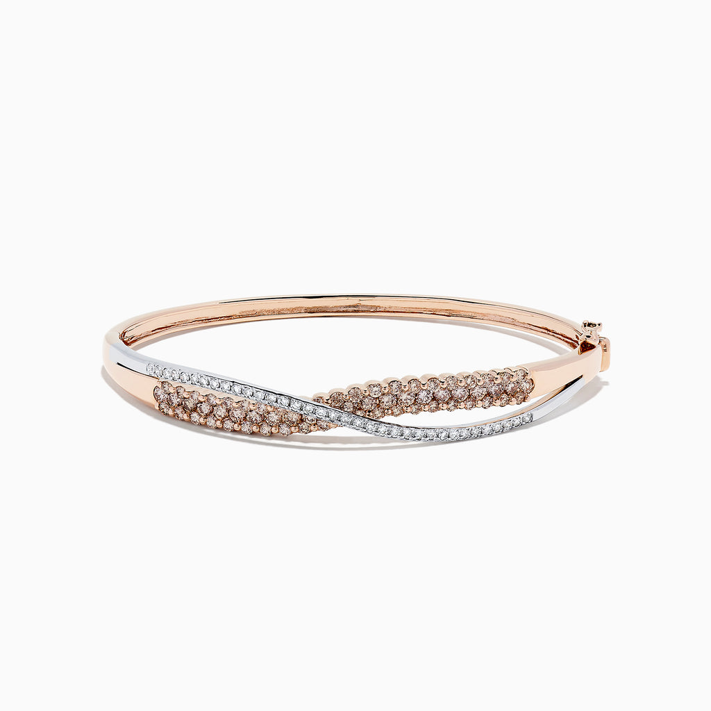 The 14K Two Tone Gold Espresso and White Diamond Crossover Bangle, 2.00 TCW, features overlapping rose gold and silver-toned bands adorned with sparkling espresso and white diamonds, secured by a hinged clasp.
