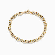 The 14K Two Tone Gold 9 Mariner Link Bracelet features interlocking mariner links with silver accents, crafted in 14K gold and displayed in a circular shape on a plain white background.