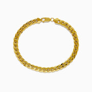 The 14K Yellow Gold 9 Cuban Chain Link Bracelet is displayed in a circular shape on a white background, featuring a secure lobster clasp.