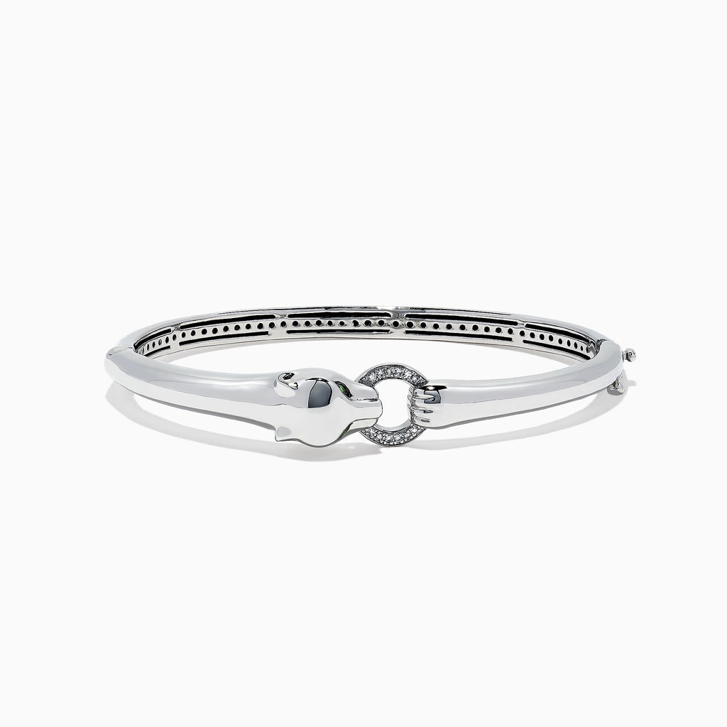 The Signature Sterling Silver Diamond and Tsavorite Panther Bangle, 0.10TCW, showcases a polished panther head detail and diamond-accented circular clasp, elegantly displayed on a white background.
