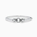 The Signature Sterling Silver Diamond and Tsavorite Panther Bangle, 0.10 TCW, features a sleek design with a central panther motif set with diamonds and tsavorites for a luxurious touch.