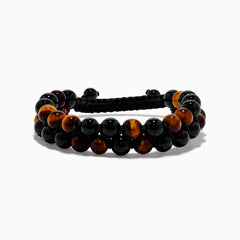 The Mens Tigers Eye Bead Bracelet features alternating glossy black and tiger’s eye brown beads, strung on a black braided adjustable cord. Stylish and versatile, its displayed on a white background—ideal for any occasion.