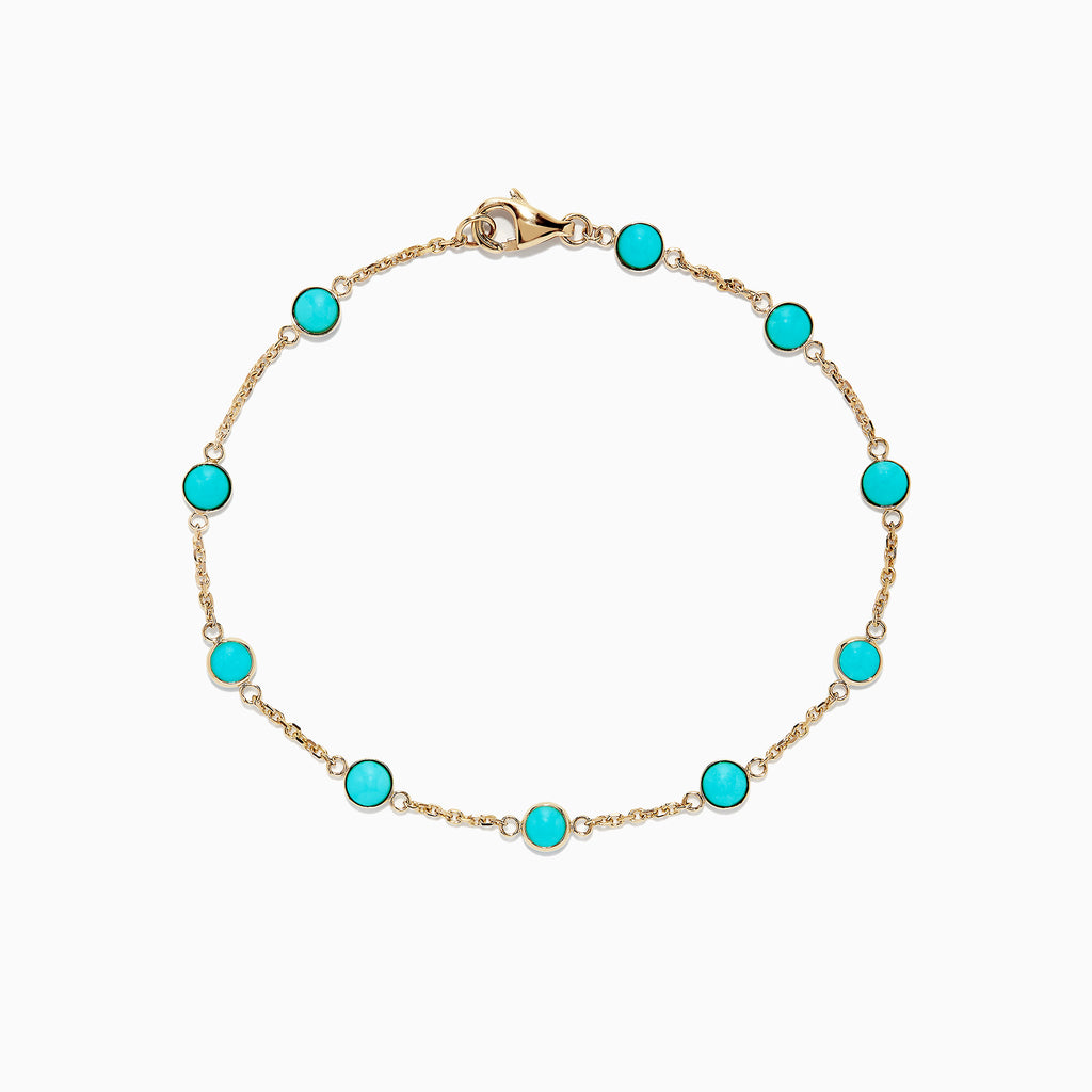 The 14K Yellow Gold Turquoise Station Bracelet, 2.35 TCW, features evenly spaced round turquoise stones on a delicate gold chain with a lobster clasp, shown on a white background.