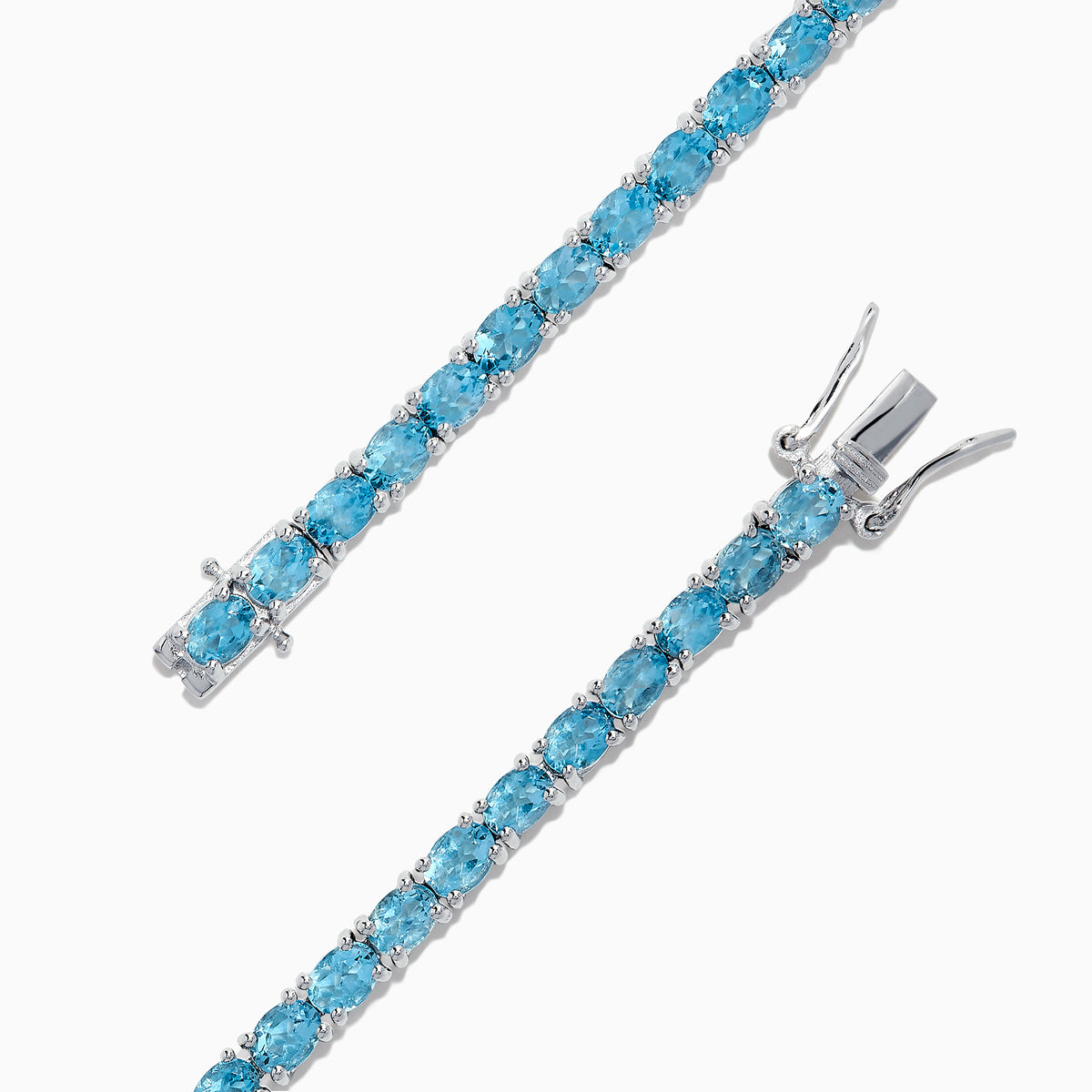 The 925 Sterling Silver Blue Topaz Tennis Bracelet, 9.55 TCW, is shown in a circular shape on a white background, featuring a continuous row of round blue topaz gemstones.