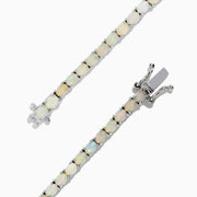 The 925 Sterling Silver Opal Tennis Bracelet features round opals totaling 4.50 TCW, each set in individual prongs and elegantly showcased on a white background.