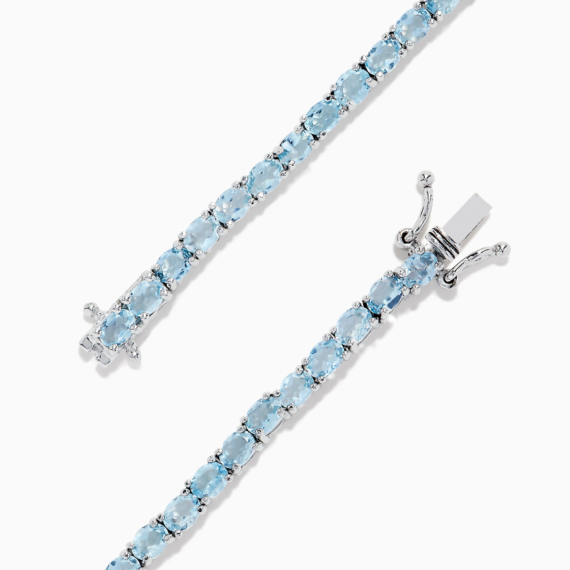 The 925 Sterling Silver Aquamarine Tennis Bracelet showcases a row of round aquamarine stones in prong settings, elegantly displayed against a plain white background.