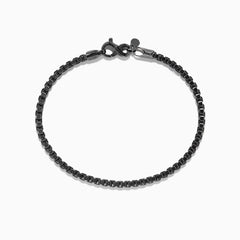 The Mens 925 Sterling Silver Black Rhodium Box Chain Bracelet features a lobster clasp and is displayed in a circular shape on a white background.