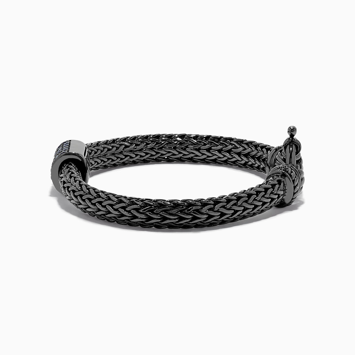 The Mens Sterling Silver Black Rhodium Braided Chain Blue Sapphire Bracelet 1.40 TCW features a square centerpiece set with blue sapphires and a round clasp, shown on a white background.