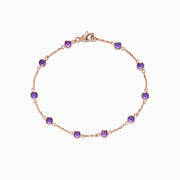 The 14K Rose Gold Amethyst Station Bracelet, 2.45 TCW, features evenly spaced round amethysts and a lobster clasp, shown on a white background.