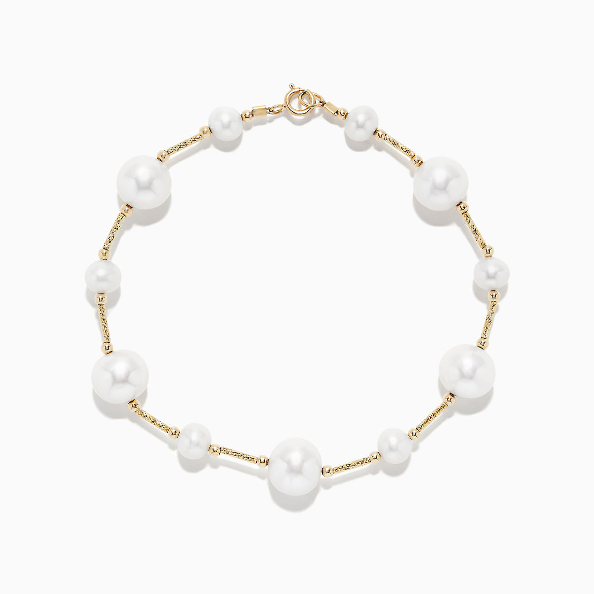 The 14K Yellow Gold Pearl Station Bracelet features round white pearls of varying sizes, evenly spaced along the gold chain, and is displayed on a plain white background.