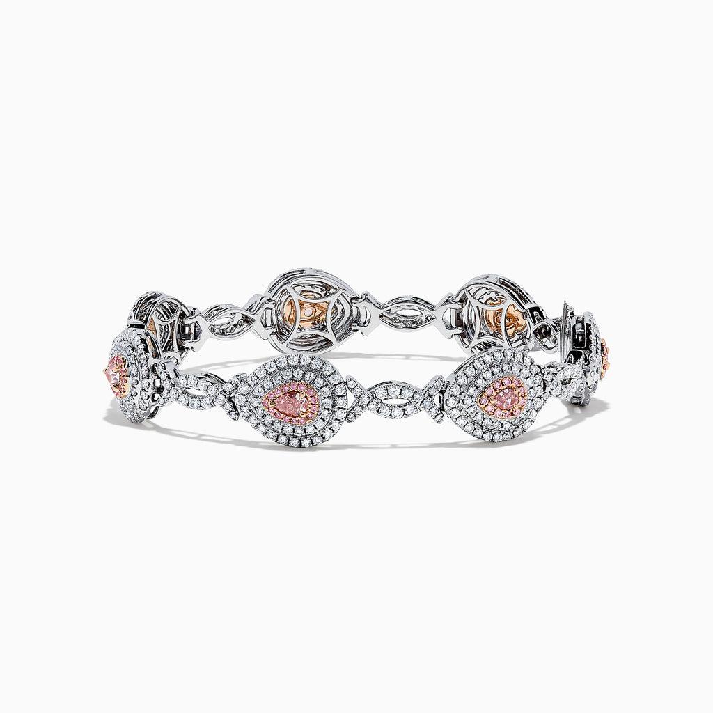 18K two-tone gold bracelet featuring GIA certified pink diamonds (5.39 TCW) in oval and marquise shapes, accented by small clear stones and detailed filigree on the sides.