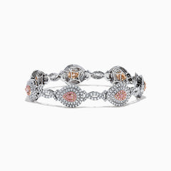 18K two-tone gold bracelet featuring GIA certified pink diamonds (5.39 TCW) in oval and marquise shapes, accented by small clear stones and detailed filigree on the sides.
