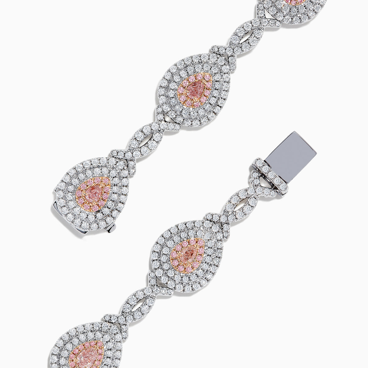18K two-tone gold bracelet featuring GIA certified pink diamonds (5.39 TCW) in oval and marquise shapes, accented by small clear stones and detailed filigree on the sides.