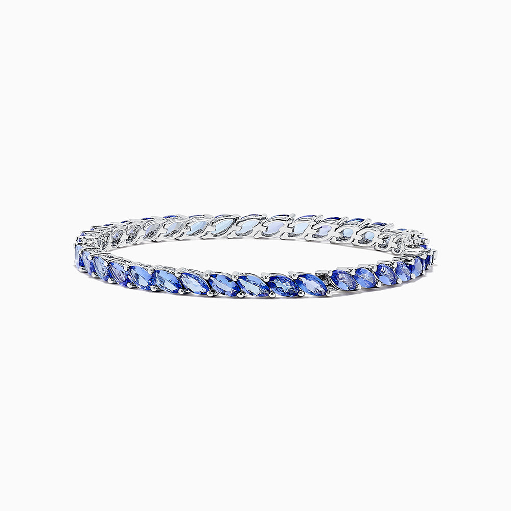 The 925 Sterling Silver Tanzanite Bracelet features a continuous row of marquise-cut tanzanite gemstones totaling 10.00 TCW, set in sterling silver for an elegant look.