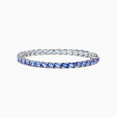 The 925 Sterling Silver Tanzanite Bracelet features a continuous row of marquise-cut tanzanite gemstones totaling 10.00 TCW, set in sterling silver for an elegant look.