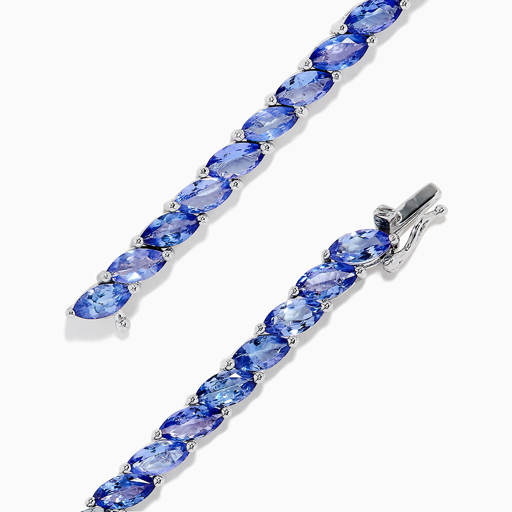 The 925 Sterling Silver Tanzanite Bracelet features a continuous row of marquise-cut tanzanite gemstones totaling 10.00 TCW, set in sterling silver for an elegant look.