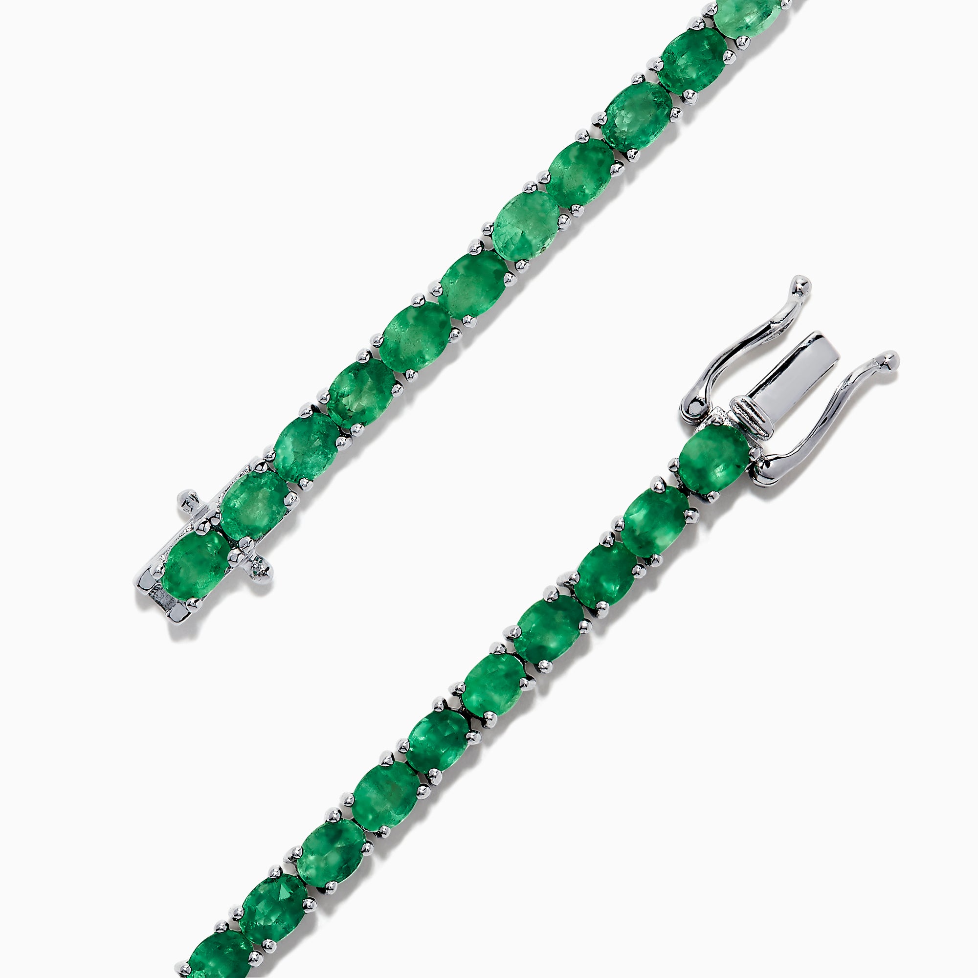 The 925 Sterling Silver Emerald Tennis Bracelet, 6.99 TCW, features a single row of round-cut green gemstones set in sterling silver with a secure clasp, shown elegantly on a white background.