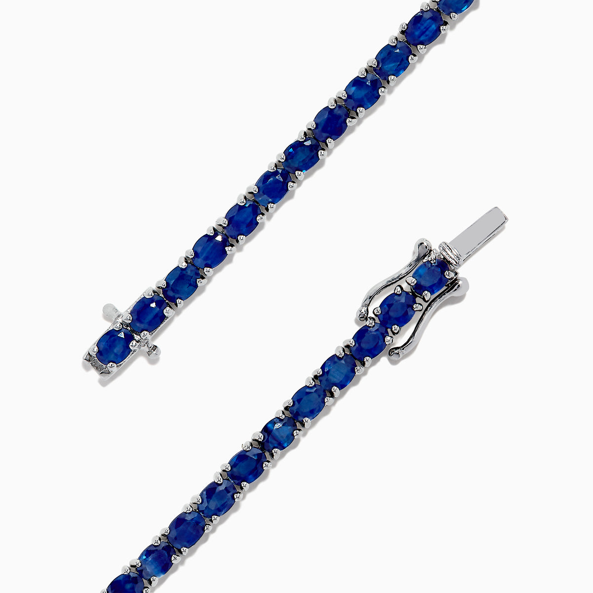 The 925 Sterling Silver Blue Sapphire Tennis Bracelet, 6.99 TCW, features evenly spaced round blue sapphires set in a slender sterling silver band and is finished with a secure clasp.