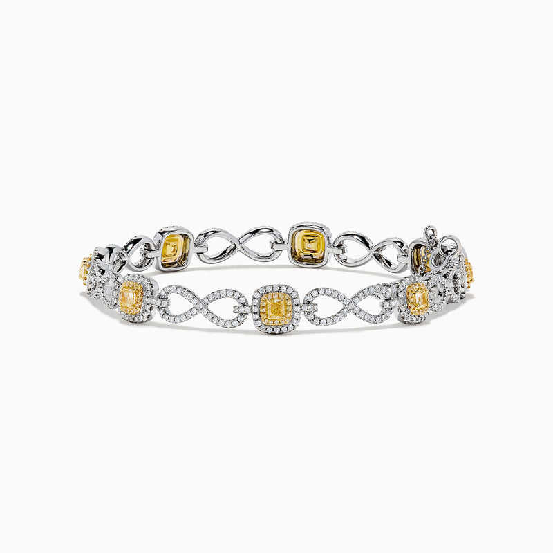 The Canare 14K Two Tone Gold Yellow and White Diamond Infinity Tennis Bracelet, 3.34 TCW, features an intricate infinity pattern set with yellow gemstones framed by diamonds and a secure right-side clasp.