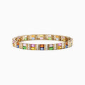 The Watercolors 14K Gold Multi Sapphire and Diamond Bracelet, 16.10 TCW, features rectangular blue, pink, green, yellow, and orange sapphires set in a repeating pattern along its length.