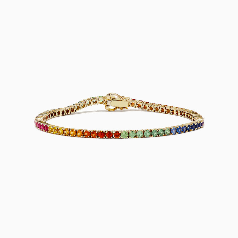The Watercolors 14K Yellow Gold Multi Sapphire Tennis Bracelet, 5.51 TCW, features a continuous row of rainbow gradient sapphires set in yellow gold, elegantly displayed on a plain white background.
