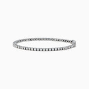 The Pave Classica 14K White Gold Diamond Tennis Bracelet 2.99 TCW, with a sleek row of sparkling diamonds, is displayed on a plain white background.