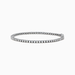 The Pave Classica 14K White Gold Diamond Tennis Bracelet 2.99 TCW, with a sleek row of sparkling diamonds, is displayed on a plain white background.