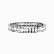 The Classique 14K White Gold Diamond Tennis Bracelet 10 TCW showcases two rows of round diamonds flanking a center row of baguette-cut diamonds, all set in stunning white gold against a white background.