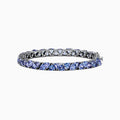 The Nahla Siri Sterling Silver Tanzanite Tennis Bracelet, 18.62 TCW, features a row of square-cut tanzanite gemstones in individual prongs and a secure clasp for an elegant, polished look.