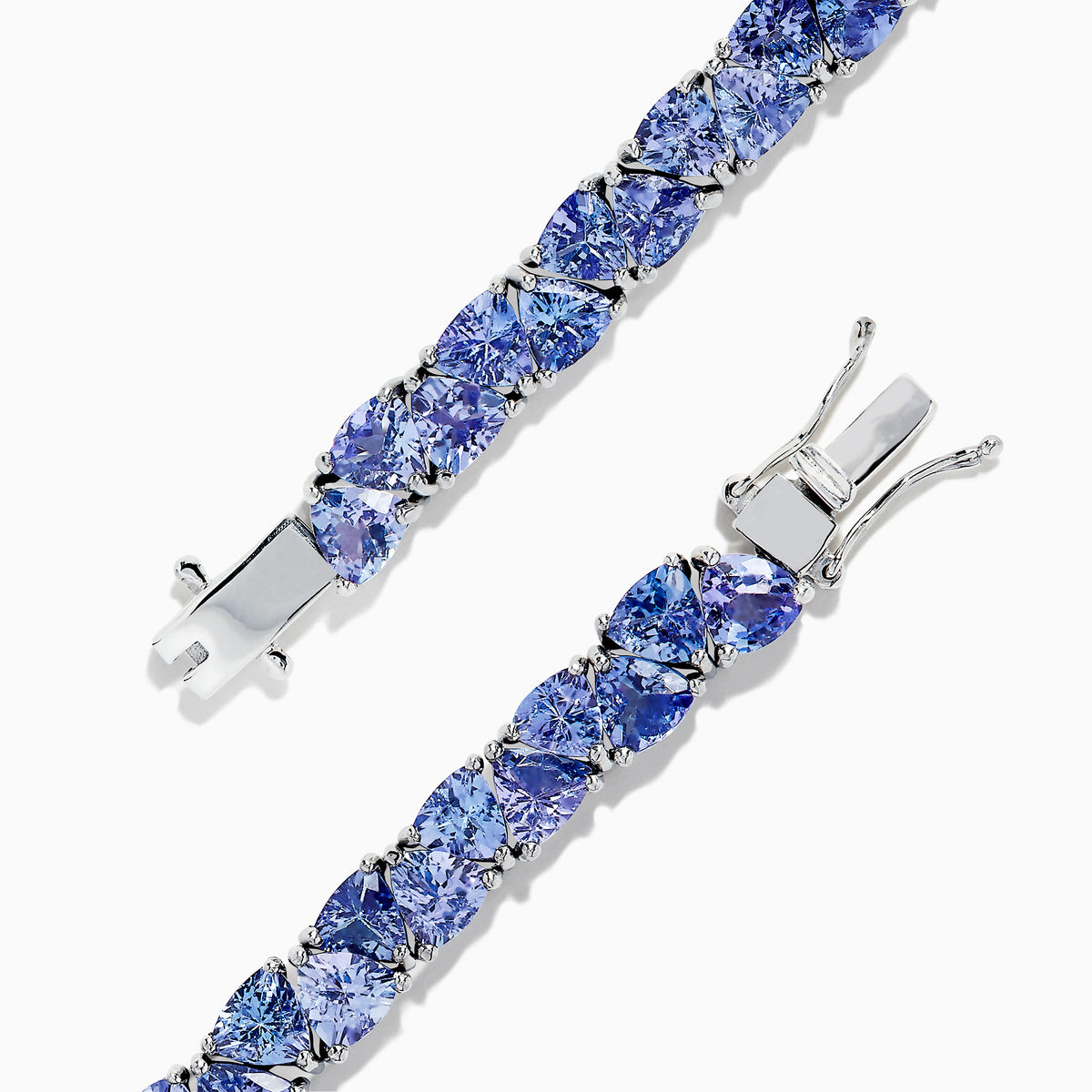 The Nahla Siri Sterling Silver Tanzanite Tennis Bracelet, 18.62 TCW, features a row of square-cut tanzanite gemstones in individual prongs and a secure clasp for an elegant, polished look.