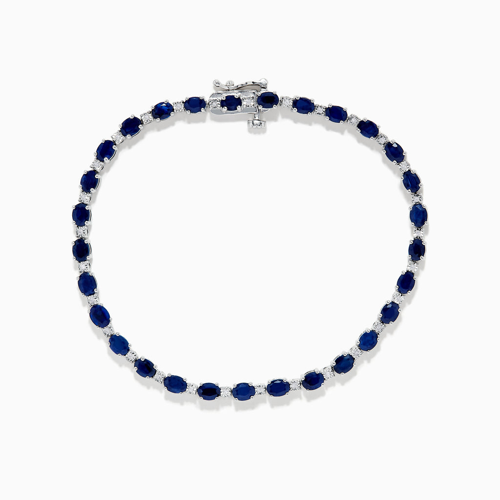 The 925 Sterling Silver Blue Sapphire Tennis Bracelet features a continuous row of oval blue sapphires set in prongs with a secure clasp.