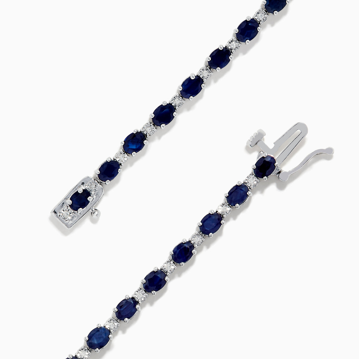 The 925 Sterling Silver Blue Sapphire Tennis Bracelet features a continuous row of oval blue sapphires set in prongs with a secure clasp.