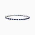 The Royale Bleu 14K Gold Sapphire and Diamond Tennis Bracelet, 4.24 TCW, showcases alternating round blue sapphires and diamonds, elegantly displayed on a white background.