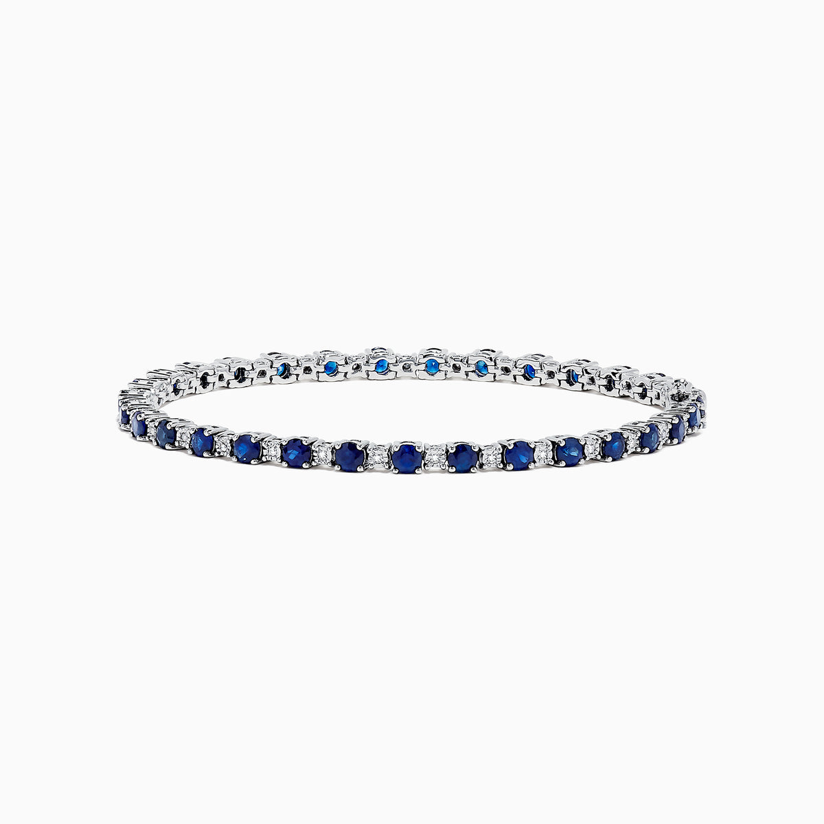 The Royale Bleu 14K Gold Sapphire and Diamond Tennis Bracelet, 4.24 TCW, showcases alternating round blue sapphires and diamonds, elegantly displayed on a white background.