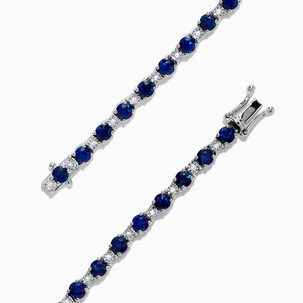 The Royale Bleu 14K Gold Sapphire and Diamond Tennis Bracelet, 4.24 TCW, showcases alternating round blue sapphires and diamonds, elegantly displayed on a white background.