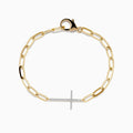 The Doro 14K Yellow Gold Diamond Cross Paperclip Bracelet features elongated links, a sideways diamond cross, and a lobster clasp closure.