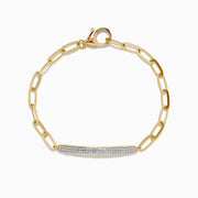 The Doro 14K Yellow Gold Diamond Paperclip Bracelet features elongated links, a curved diamond bar totaling 0.24 TCW, and a secure lobster clasp.