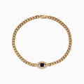 A 14K yellow gold bracelet featuring a central diamond evil eye with a blue sapphire center surrounded by white stones, displayed on a white background.