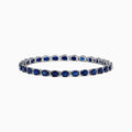 The Royale Bleu 14K Gold Sapphire & Diamond Tennis Bracelet features a continuous row of oval sapphires and diamonds, totaling 12.21 TCW, set in prongs for an elegant and timeless look.